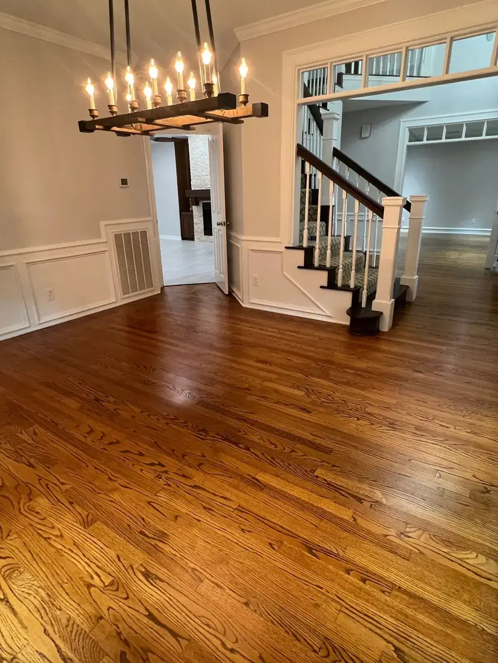 Refinished hardwood floor with staircase