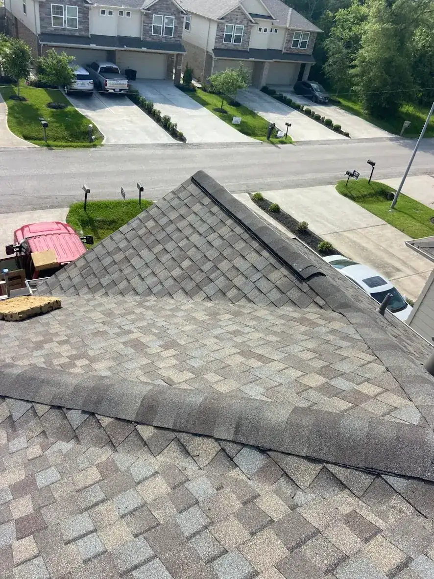 Aerial view of a completed shingle roof installation by ProRoofs and Restoration