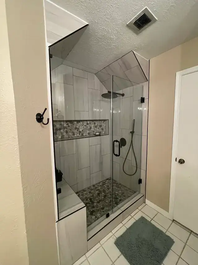 Wide view of a completed walk-in shower remodel