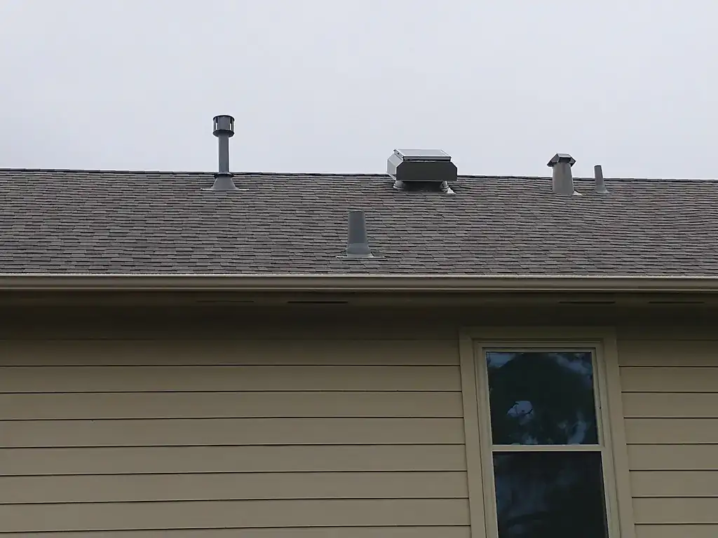 Roof vents including an Attic Breeze solar attic fan
